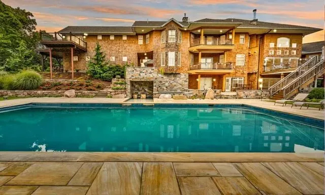 An image of beautiful holiday home with a swimming pool